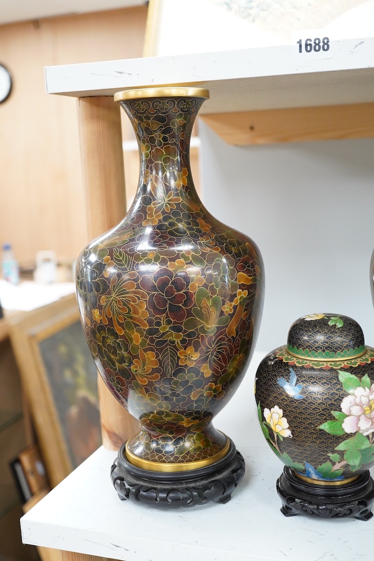 A pair of Chinese cloisonné enamel vases on stands and similar ginger jar, vases 34.6cm high including stands.